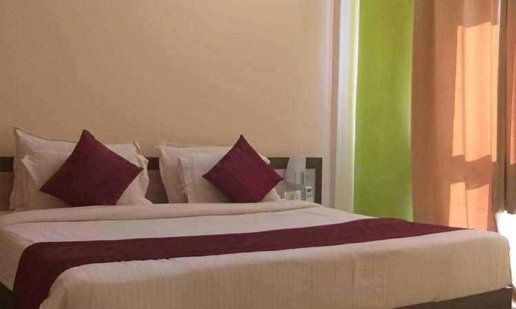 Om Leisure Resort Puri - Decorated Bed