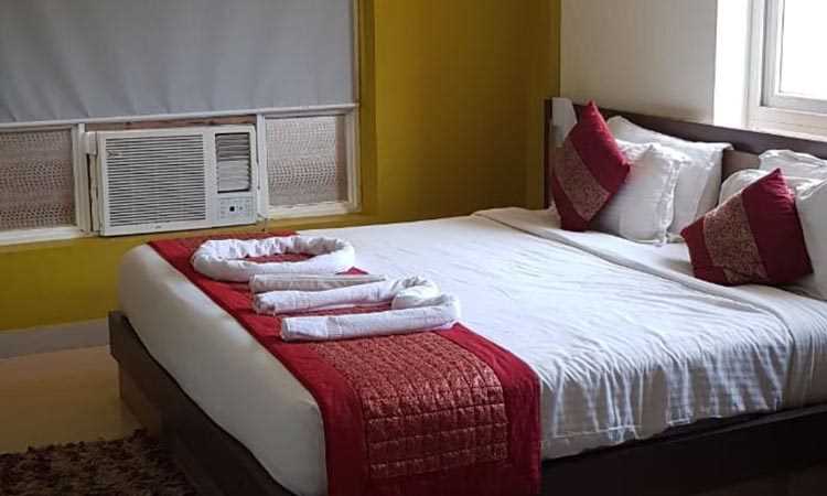 Om Leisure Resort Puri - Decorated Bed With AC